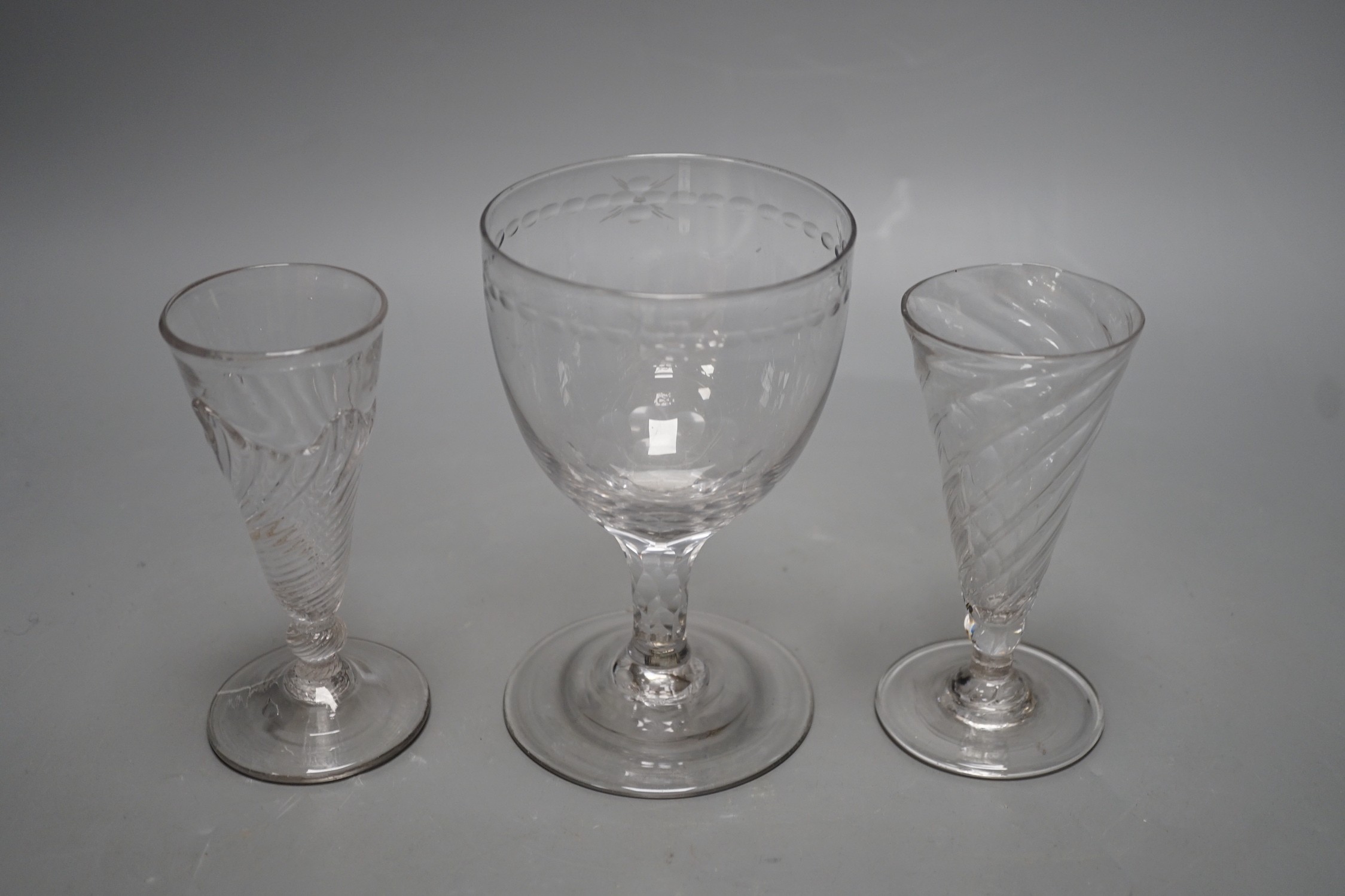 Two wrythen ale flutes, 18th century and a facet stem ‘OXO’ glass rummer, tallest 15cms high